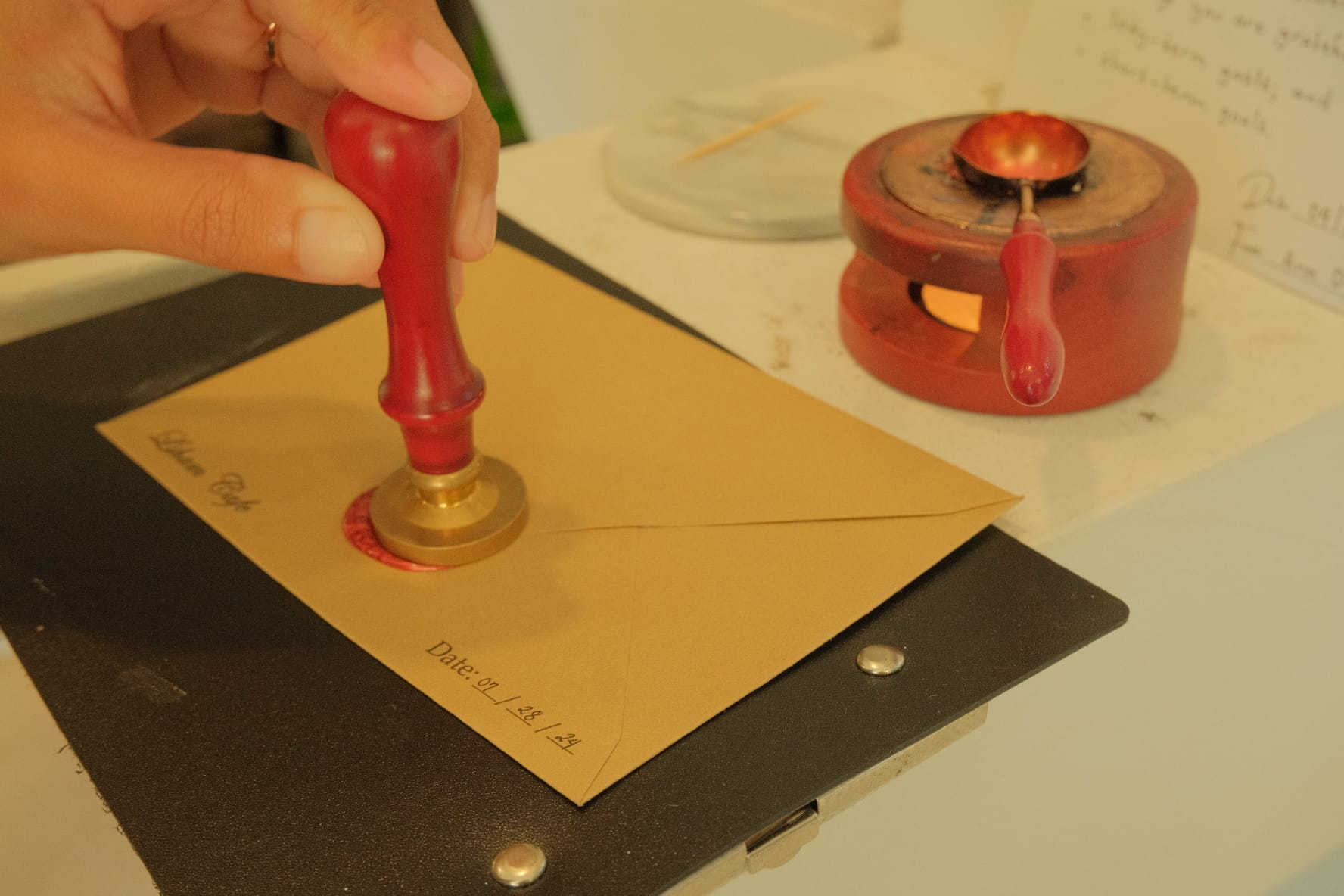 Sealing an envelope with wax